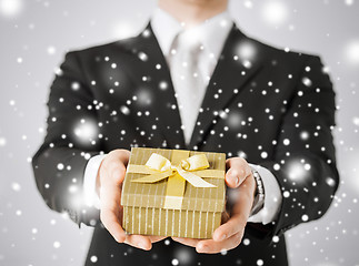Image showing man giving gift box