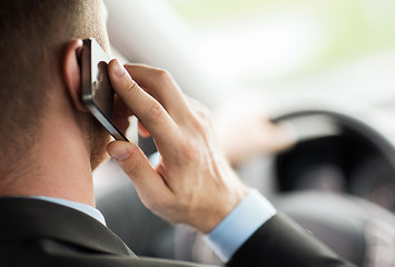 Image showing man using phone while driving the car