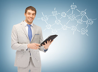 Image showing businessman networking with tablet pc