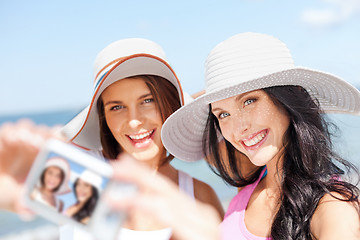 Image showing girls taking self portrait on the beach