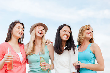 Image showing girls with drinks on the beach