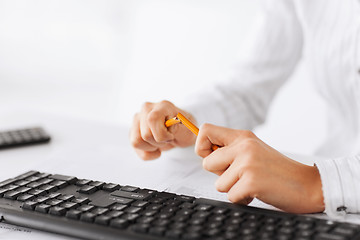 Image showing woman breaking pencil