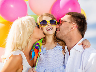 Image showing family with colorful balloons