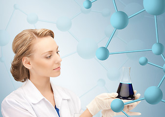 Image showing lab worker holding up test tube