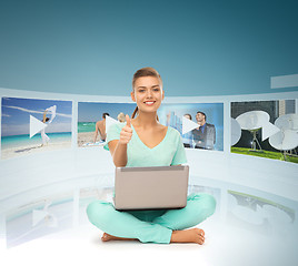 Image showing woman with laptop pc and virtual screens