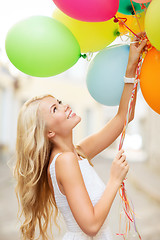 Image showing woman with colorful balloons