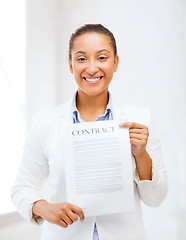 Image showing african businesswoman holding contract