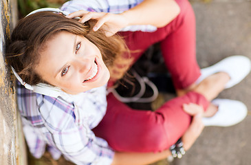 Image showing girl with headphones listening to music