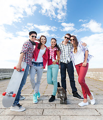 Image showing teenagers with skates outside