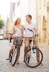 Image showing couple with bicycles in the city
