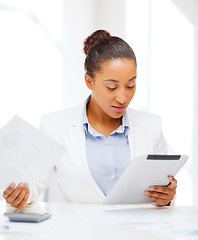 Image showing businesswoman with tablet pc in office