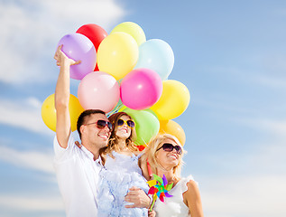 Image showing family with colorful balloons