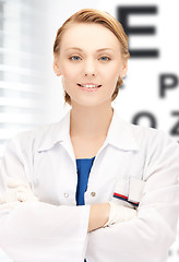 Image showing female ophthalmologist with eye chart