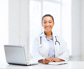 Image showing female doctor with laptop pc