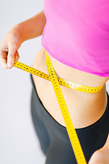 Image showing trained belly with measuring tape