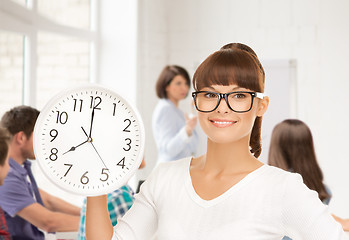 Image showing student showing clock