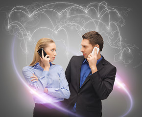 Image showing man and woman calling with smartphones