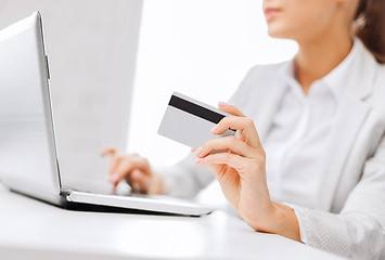 Image showing businesswoman with laptop and credit card