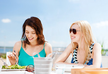 Image showing girls in cafe on the beach