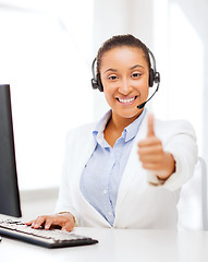 Image showing african female helpline operator showing thumbs up