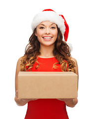 Image showing smiling woman in santa helper hat with parcel box