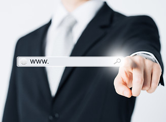 Image showing businessman pressing Search button