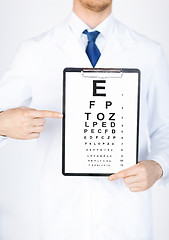 Image showing male ophthalmologist with eye chart