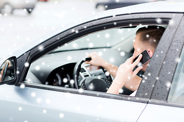 Image showing man using phone while driving the car