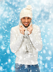 Image showing handsome man in warm sweater, hat and scarf