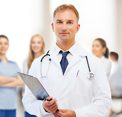 Image showing male doctor with stethoscope and clipboard