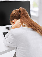 Image showing stressed woman with computer