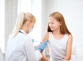 Image showing doctor doing vaccine to child in hospital