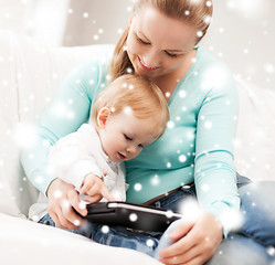 Image showing mother and adorable baby with tablet pc