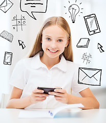 Image showing girl with smartphone at school