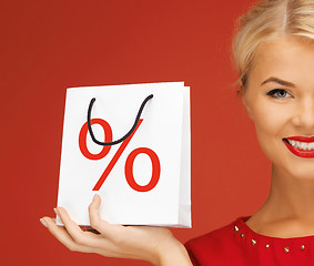 Image showing woman holding bag with percent sign