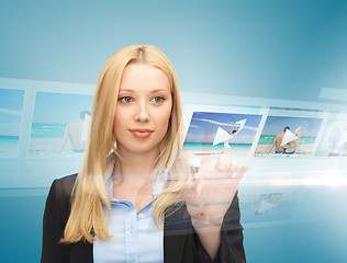 Image showing businesswoman with virtual screen