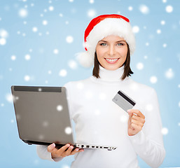 Image showing woman in santa hat with laptop and credit card