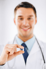 Image showing doctor with pill in hospital