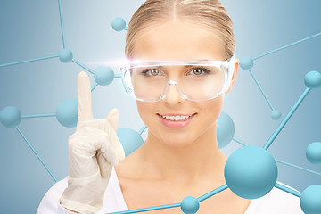 Image showing woman in protective glasses and gloves