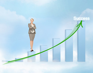 Image showing businesswoman with big 3d chart