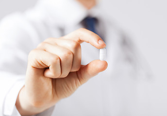 Image showing doctor with pill in hospital