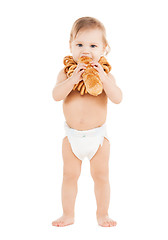 Image showing cute todler eating long bread