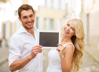 Image showing couple with tablet pc in the city