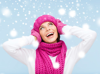 Image showing surprised woman in hat, muffler and mittens