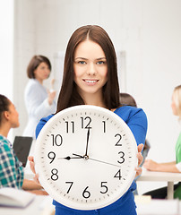 Image showing student showing clock