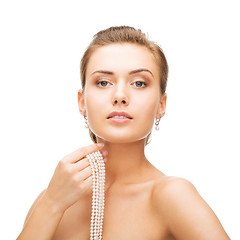 Image showing beautiful woman with pearl earrings and bracelet