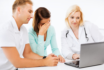 Image showing doctor with patients in hospital