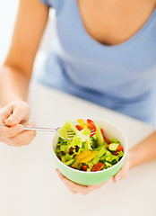 Image showing woman eating salad with vegetables