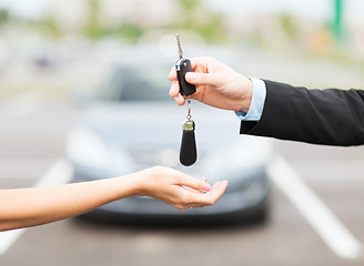 Image showing customer and salesman with car key