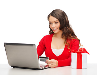 Image showing woman with gift, laptop computer and credit card